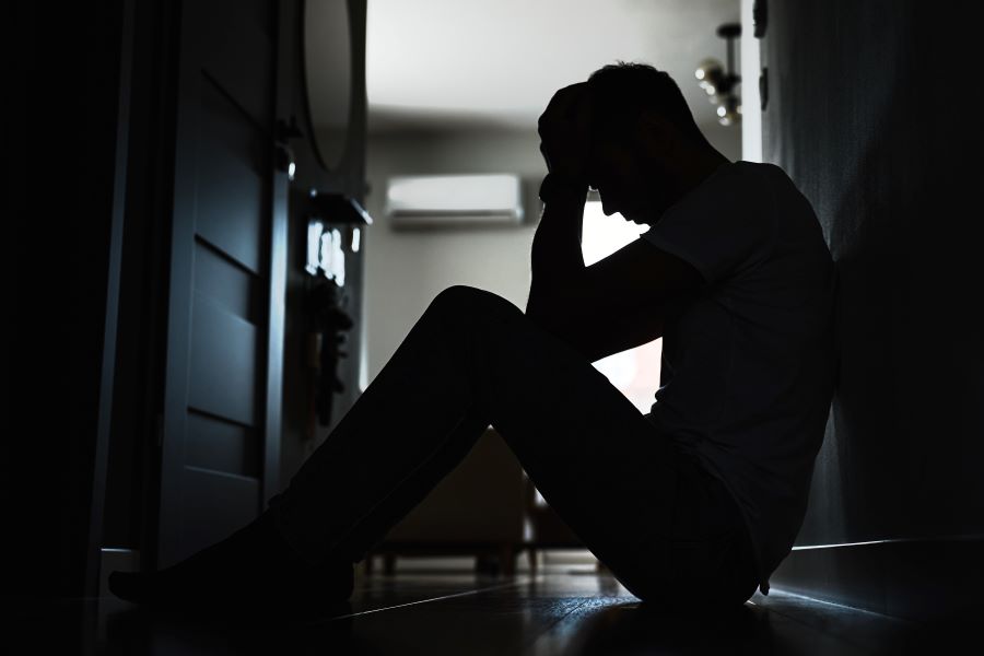 silhouette-of-a-man-seated-on-the-floor